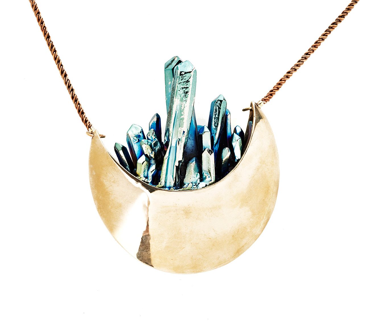 Pamela Love Crystal Crescent necklace: a bronze crescent pendant filled with blue-green crystal points on a fine chain